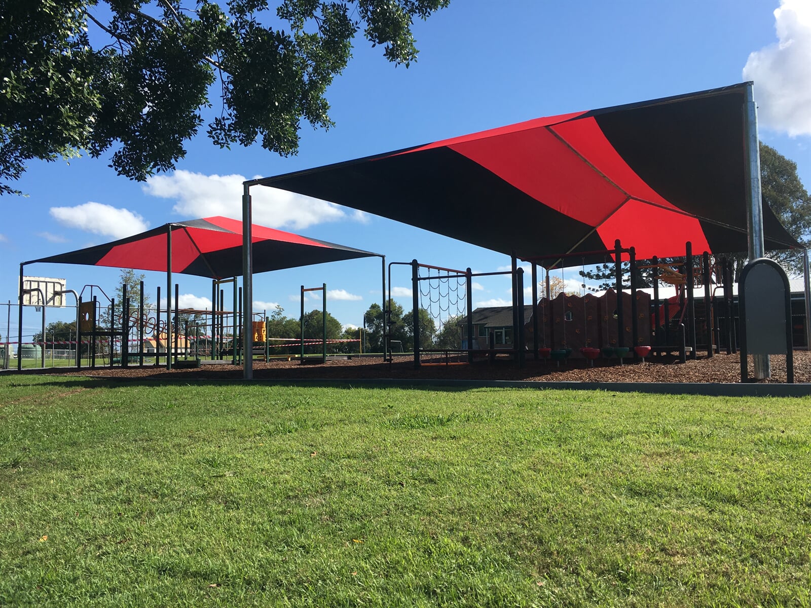 Large commercial shade sail structure installed over a public outdoor area in Grafton on the North Coast