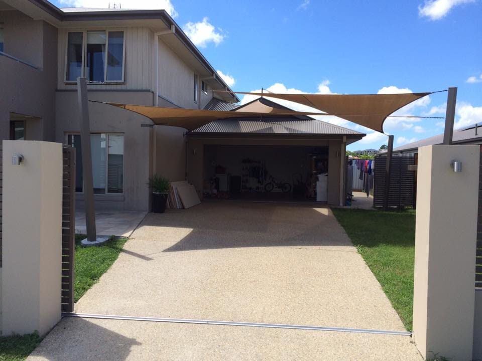 Custom residential shade sail installed over a backyard outdoor area in Grafton on the North Coast